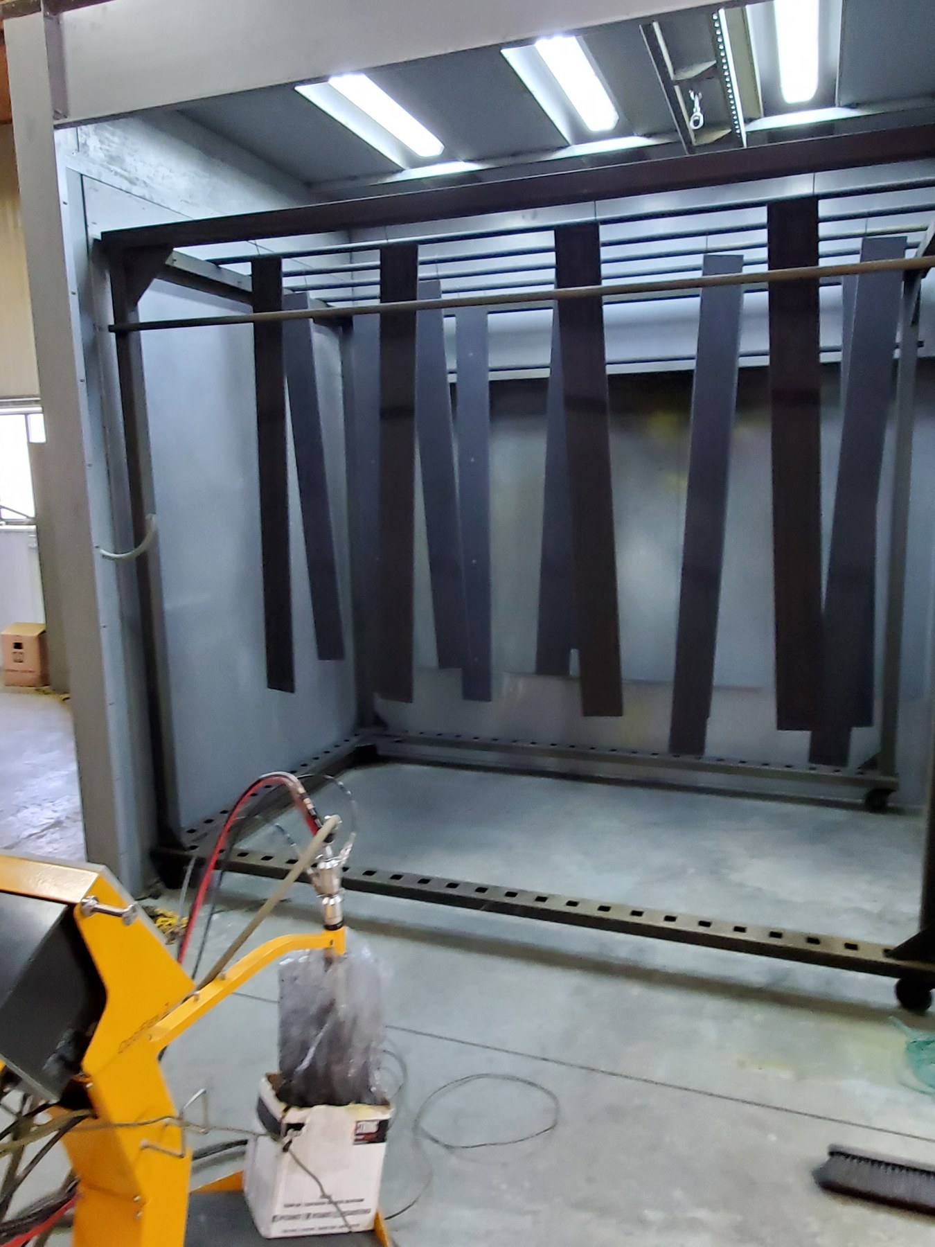 An elevator cab frame in the CabCraft powder coat booth