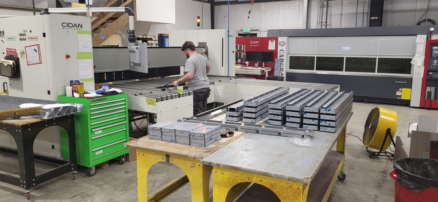 CNC metal folder and formed elevator panel parts on the CabCraft production floor