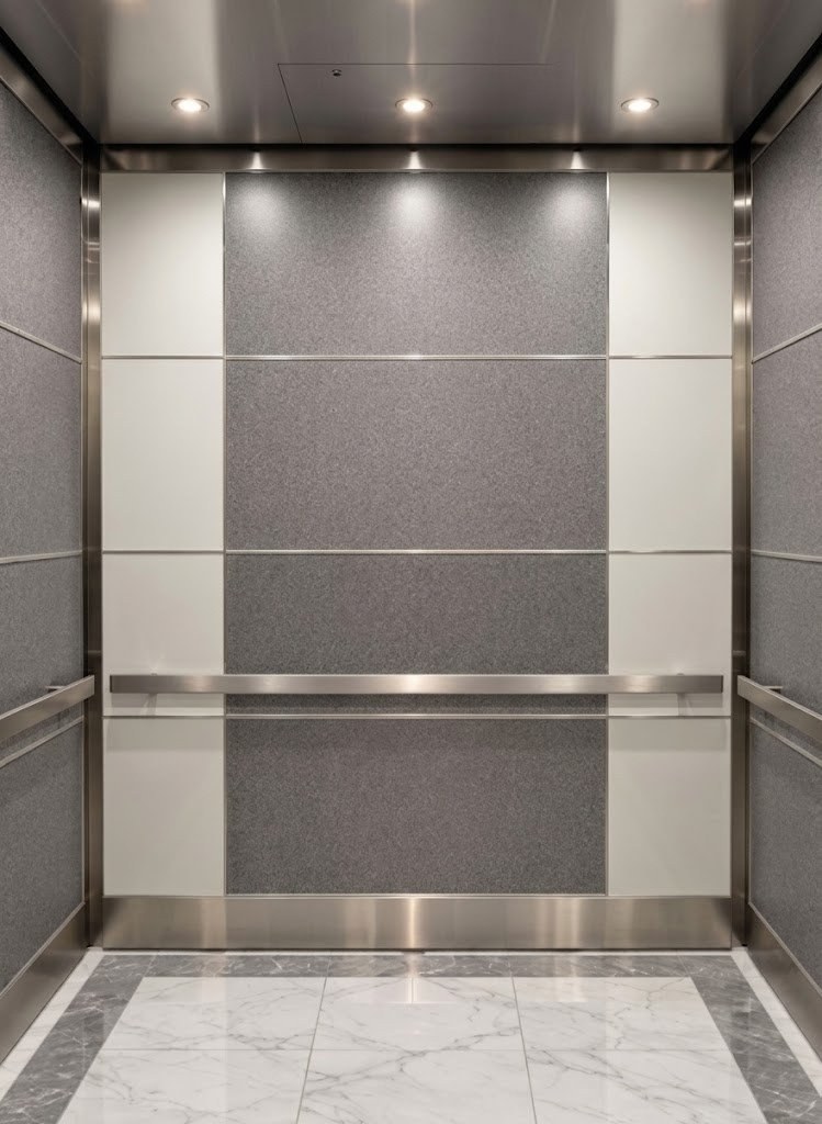 Elevator cab with laminate wall panels