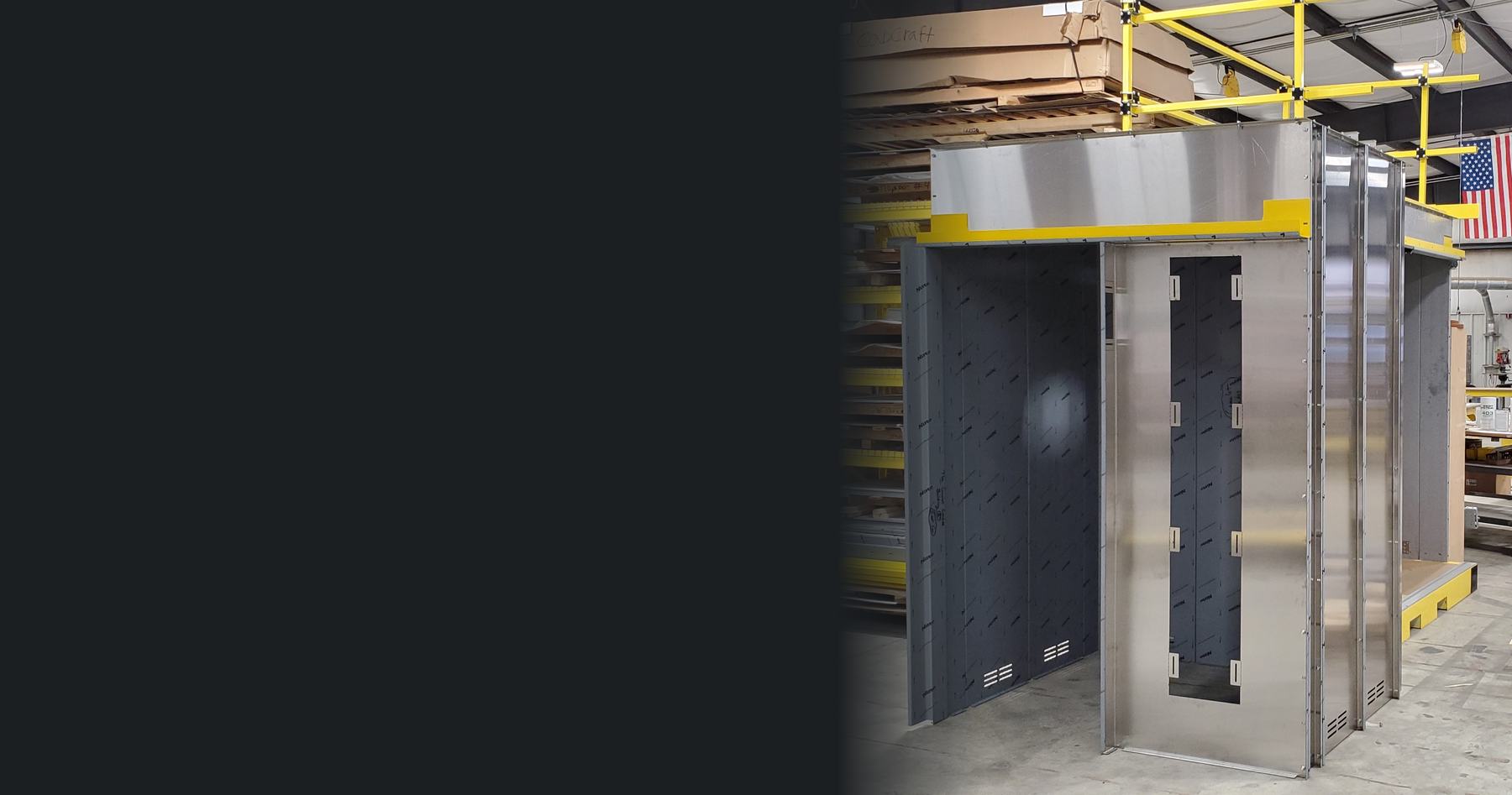 A textured stainless steel elevator cab shell on the CabCraft production floor